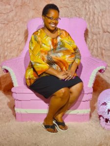 Carmen sits upon a Pink Lego Throne